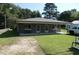 Charming single-story home featuring a well-maintained lawn, covered porch, and neutral-toned exterior at 216 Clayton St, Rocky Mount, NC 27803