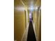 Bright hallway featuring neutral paint, tile floors, and carpet runner at 216 Clayton St, Rocky Mount, NC 27803