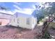 Exterior view of a charming home with a spacious backyard and mature trees at 2305 Poole Rd, Raleigh, NC 27610