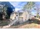 Exterior of a cute, vintage-style home featuring a small porch with wooden railings at 2305 Poole Rd, Raleigh, NC 27610