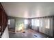 Living room during renovation with open studs, paint cans, and natural light at 2305 Poole Rd, Raleigh, NC 27610