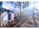 Backyard shed, with potential for storage or as a workshop, amidst lush greenery at 2305 Poole Rd, Raleigh, NC 27610