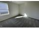 Bedroom featuring plush carpet, a large window for natural light, and neutral wall paint at 24 Heatherglenn Cir, Princeton, NC 27569