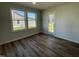 Cozy dining area with wood flooring, abundant natural light, and access to the outdoor space at 24 Heatherglenn Cir, Princeton, NC 27569