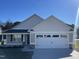 Charming single-story home featuring a two-car garage, neutral siding, and manicured lawn at 24 Heatherglenn Cir, Princeton, NC 27569