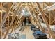 Spacious unfinished attic, perfect for storage or conversion with exposed rafters at 2504 Georgianna Dr, Wake Forest, NC 27587
