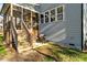 Back porch has plenty of room for grilling; staircase leads down to lower-level storage and a grassy area at 2504 Georgianna Dr, Wake Forest, NC 27587