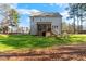 Home has a screened porch, a small deck, fenced in area, and large green backyard at 2504 Georgianna Dr, Wake Forest, NC 27587