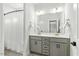 Bright bathroom with a double sink vanity, neutral color palette, and shower/tub combo at 2504 Georgianna Dr, Wake Forest, NC 27587