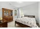 Inviting bedroom featuring natural light, neutral walls, and a charming wood-frame bed at 2504 Georgianna Dr, Wake Forest, NC 27587