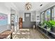 Inviting entryway with hardwood floors, gray wainscoting, and a decorative light fixture at 2504 Georgianna Dr, Wake Forest, NC 27587