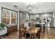 Open-concept kitchen and dining area with stainless steel appliances, custom cabinets, and hardwood floors at 2504 Georgianna Dr, Wake Forest, NC 27587
