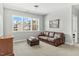 Well-lit living room with comfortable leather sofa and view at 2504 Georgianna Dr, Wake Forest, NC 27587