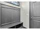 Gray mudroom features coat rack, bench, and cubbies for organization at 2504 Georgianna Dr, Wake Forest, NC 27587