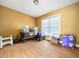 Spacious bedroom features wood flooring, a large window, and lots of storage at 2574 Primrose Ln, Creedmoor, NC 27522