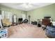 Bedroom with carpet, a ceiling fan, two windows, and room for a desk and chair at 2574 Primrose Ln, Creedmoor, NC 27522