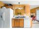 Another view of the kitchen featuring a double sink, dishwasher, and view to living room at 2574 Primrose Ln, Creedmoor, NC 27522