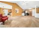 Spacious living room featuring neutral carpet, yellow walls, and an open layout at 2574 Primrose Ln, Creedmoor, NC 27522