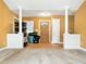 Inviting living room featuring hardwood floors, columns and a view of the front door at 2574 Primrose Ln, Creedmoor, NC 27522