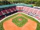 Aerial view of the baseball field and stadium highlighting seating, open-air sky lounge, and well-maintained green space at 268 Sweetbay Tree Dr, Wendell, NC 27591