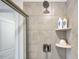 A glass enclosed shower with a shower caddy and modern fixtures at 268 Sweetbay Tree Dr, Wendell, NC 27591