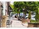 Street view highlighting sidewalks with trees, street lamps, planters, and outdoor cafe seating in a walkable community at 268 Sweetbay Tree Dr, Wendell, NC 27591