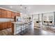 Open-concept kitchen featuring an island, stainless steel appliances, and seamlessly connected living spaces at 270 Sweetbay Tree Dr, Wendell, NC 27591