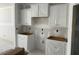 Unfinished kitchen featuring white cabinets and drywall, showcasing a spacious layout awaiting final touches at 277 Gregory Village Dr, Lillington, NC 27546