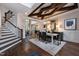 Elegant dining room with decorative ceiling beams, modern chandelier, and open floor plan at 292 Choice Trl, Pittsboro, NC 27312