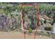 Aerial view of wooded land parcel for sale near a body of water with mature trees at 292 Choice Trl, Pittsboro, NC 27312