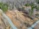Aerial view of land parcel for sale featuring some cleared space and mature trees at 292 Choice Trl, Pittsboro, NC 27312