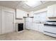 Functional kitchen with white appliances, ample cabinet space, and a practical layout at 318 Mcmasters St, Chapel Hill, NC 27516