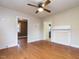 Open living room with hardwood floors, neutral walls, and multiple doorways to other rooms at 318 Mcmasters St, Chapel Hill, NC 27516