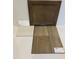Interior finishes including brown cabinet, wood floor, and quartz countertop selections at 324 Chesapeak Commons St # 143, Garner, NC 27529