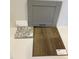 Showcasing ELKINS Stone Gray cabinets alongside granite countertop and luxury vinyl flooring samples at 328 Chesapeak Commons St # 142, Garner, NC 27529