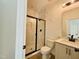 Modern bathroom with sleek black-framed shower and stylish vanity with a white countertop at 3291 Roundly Rd # 14, New Hill, NC 27562