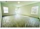 Bright, open bedroom with lots of light and windows, space is prepped for flooring and finishing touches at 3291 Roundly Rd # 14, New Hill, NC 27562
