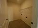 Functional laundry room featuring tiled floor, storage shelving, and utility connections at 3291 Roundly Rd # 14, New Hill, NC 27562