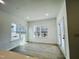 Bright living space filled with natural light through large windows showcasing the outdoor views at 3291 Roundly Rd # 14, New Hill, NC 27562