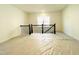 Large loft area with black wrought iron railing, prepped for flooring and finishing touches at 3291 Roundly Rd # 14, New Hill, NC 27562