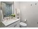 Half-bath features patterned tile flooring, vanity, and decorative mirror at 35 Rogerson Dr, Chapel Hill, NC 27517