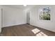 Cozy bedroom with hardwood floors, a window overlooking a green view, and neutral paint at 35 Rogerson Dr, Chapel Hill, NC 27517