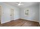Neutral bedroom with hardwood floors and a large window at 35 Rogerson Dr, Chapel Hill, NC 27517
