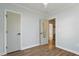 Light-filled bedroom features hardwood floors, with two doors and light blue wall at 35 Rogerson Dr, Chapel Hill, NC 27517