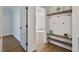 Bright entryway with storage and bench seating, wooden shelves and coat rack at 35 Rogerson Dr, Chapel Hill, NC 27517