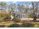 Charming home exterior with screened porch and lush landscaping at 35 Rogerson Dr, Chapel Hill, NC 27517