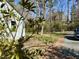 This property features a paved walkway, lush green lawn, and meticulous landscaping, and serene surroundings at 35 Rogerson Dr, Chapel Hill, NC 27517