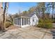 Home featuring a screened-in porch and meticulous landscaping at 35 Rogerson Dr, Chapel Hill, NC 27517