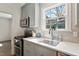 Kitchen with white countertops, stainless steel appliances, and a large window at 35 Rogerson Dr, Chapel Hill, NC 27517