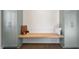Mud room with built in bench and storage cabinets, features hardwood floors at 35 Rogerson Dr, Chapel Hill, NC 27517